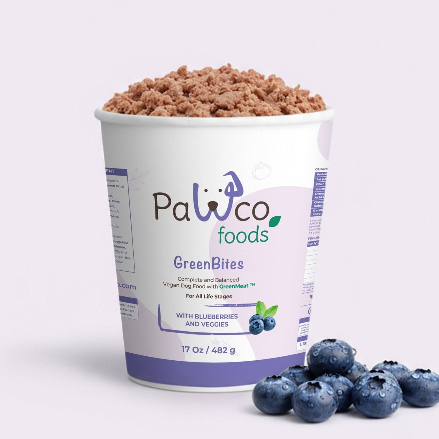 Container of Pawco Foods GreenBites with blueberries on a white background
