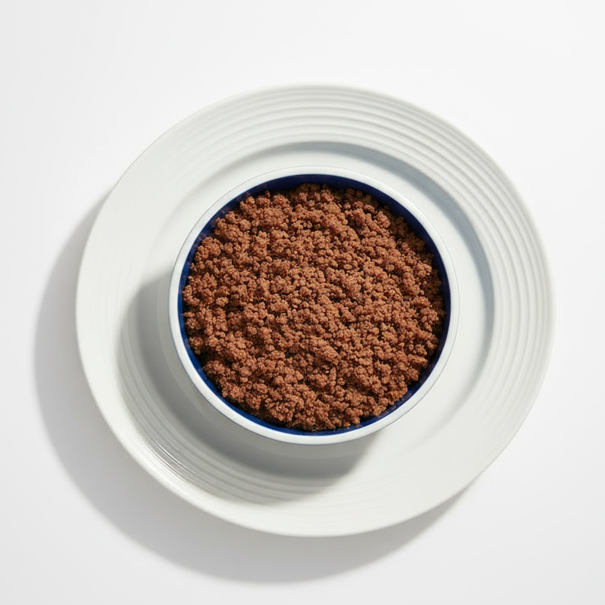 PawCo GreenBites Blueberries & Veggies healthy, high quality fresh dog food  – top view of bowl and plate with food on white background – PawCo Foods